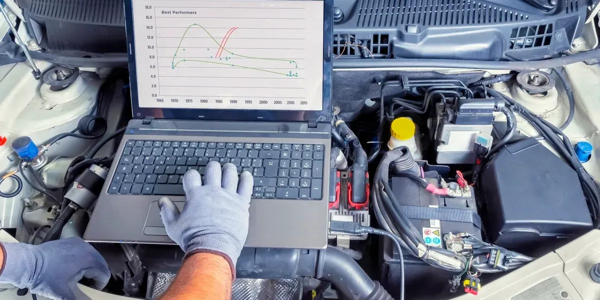 Diagnostic laptop on engine